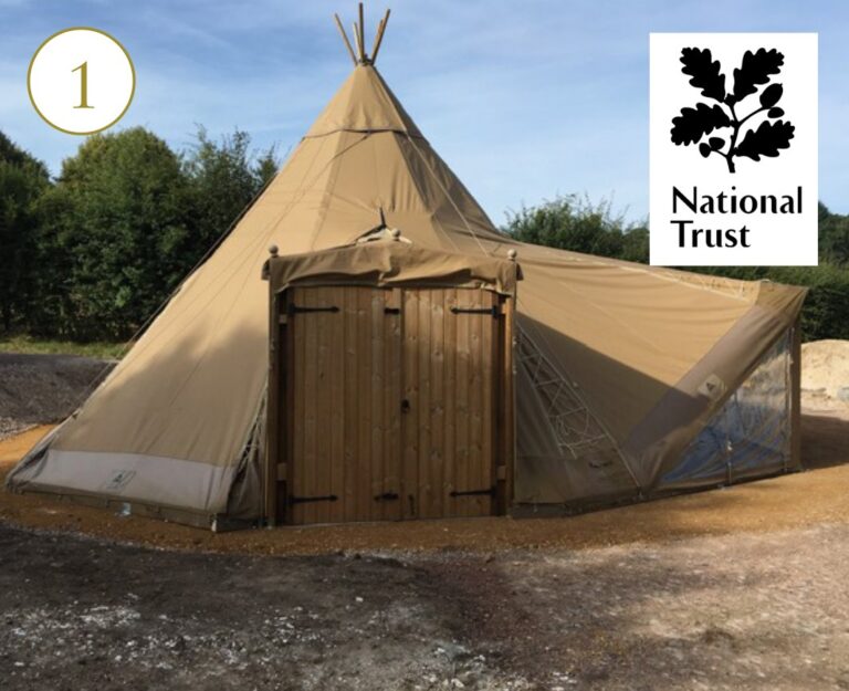 A wigwam-like structure with the National Trust logo