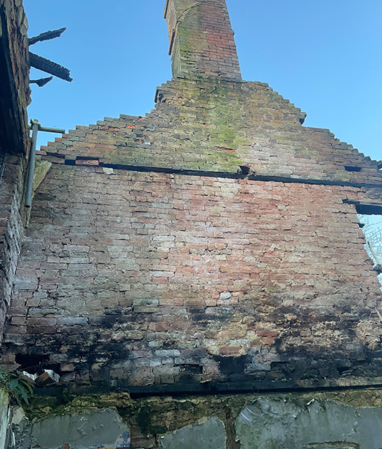 Fire damaged gable wall
